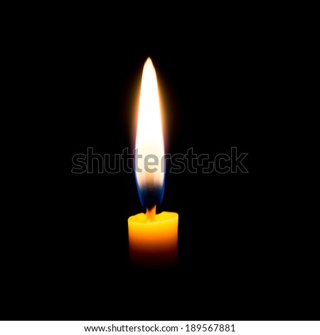 Burning praying candle isolated on black background