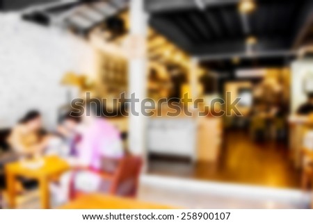 Blur background of people in coffee shop cafe and restaurant.