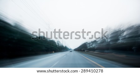 Car driver on the road in speed motion blur. Speed motor, car accident concept.