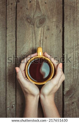 Female Hands Holding Cup Of Coffee