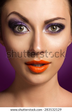 Beautiful Fashion Portrait With Professional Makeup On Purple Background
