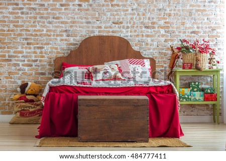 Red Bed In Christmas Interior On Brick Wall Background