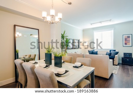 Modern bright dining room with a living room in a luxury apartment. Interior design.