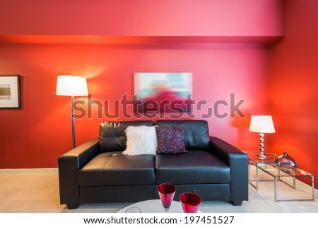 Modern bright, red living room in a luxury house. Interior design.
