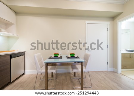 Dining table set for two in a modern kitchen. Interior design.