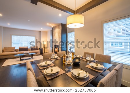 Spacious bright living room and dining room with a fireplace. Interior design.