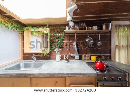 Rustic kitchen in a bright cabin. Interior design.