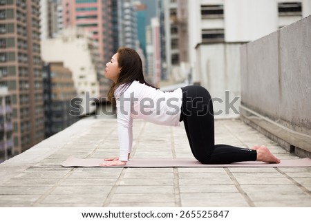 Yoga Position on a Rooftop in Hong Kong Island