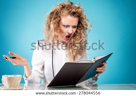 Angry businesswoman at work. Young girl looking at notes.