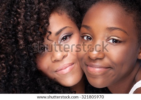Closeup beauty portrait of young african american girls with glamour makeup.