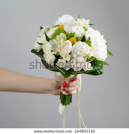 Nice and beautiful bridge bouquet in the hand