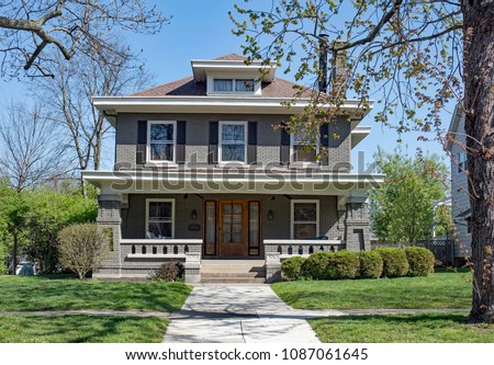 Gray Brick Craftsman Style House with Open Porch