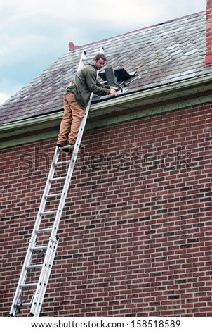 Roof Worker on Ladder