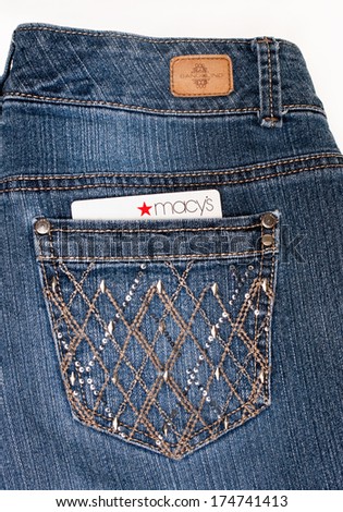 DAYTON, OHIO-FEBRUARY 2, 2014:Bandolino designer jeans pocket with Macys credit card. Bandolino is fashions by designer, Enzo Anioglini; Macys is USAs largest retail department store in retail sales.