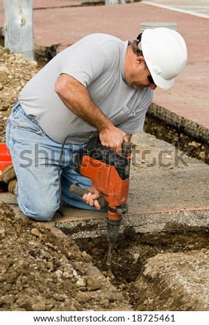Worker using Hammer Chisel