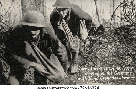 Barbed Wire Cut - Early 1900\'s WWI postcard depicting Americans going through cut barbed wire with bags of grenades toward Germans.