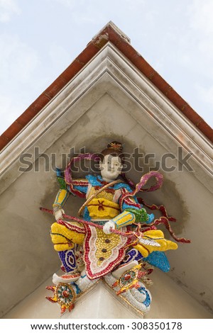 High Relief Sculpture of Nezha, Chinese God, decorated with ceramic, Wat Pariwat Temple, Rama 3 road, Bangkok, Thailand