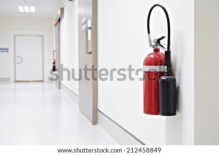 Install a fire extinguisher on the wall in building