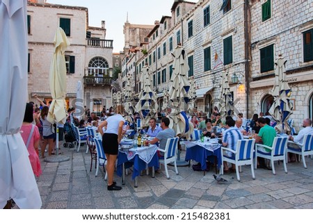 DUBROVNIK, CROATIA - MAY 16, 2014: tables of a street restaurant in the old town of Dubrovnik. On 16 May 2014 in Dubrovnik, Croatia