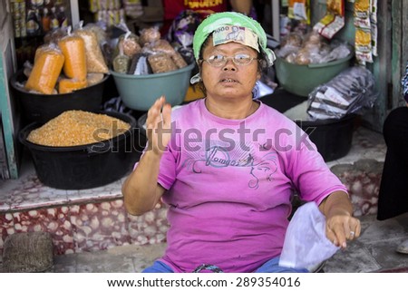 PENIDA ISLAND, INDONESIA - JUNE 21.2015:  woman  at the market, village Toyopakeh, Nusa Penida June 21. 2015 Indonesia