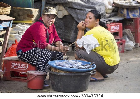 PENIDA ISLAND, INDONESIA - JUNE 22.2015:  woman Hindu at the market, village Toyopakeh, Nusa Penida June 22. 2015 Indonesia