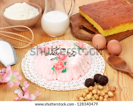 Greetings cake with cream, setting