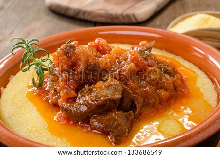 Meat of wild boar with polenta, close-up, selective focus