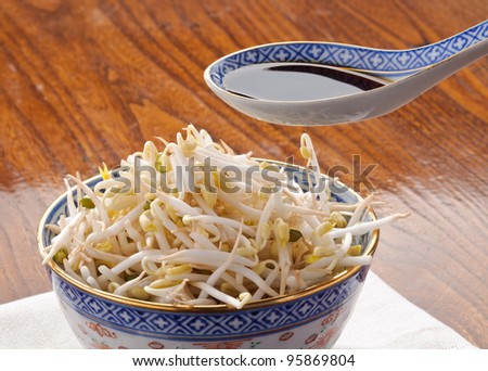 Soy sprouts and soy sauce in the spoon