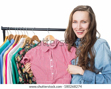 Woman shopping clothes. Shopper enjoy shopping happy smiling in store. studio shot