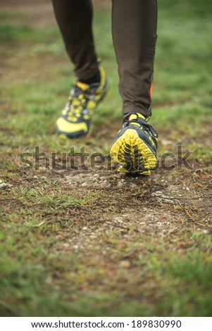 Athlete running sport feet on trail healthy lifestyle fitness