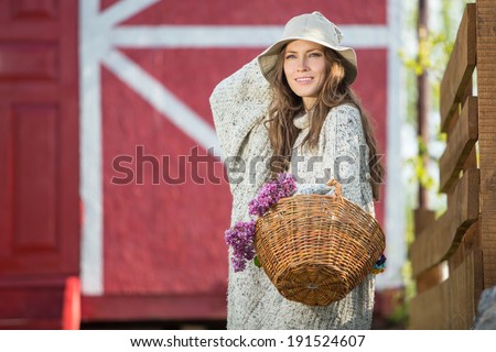 Beautiful sunny portrait of a girl in the country. Rural country style