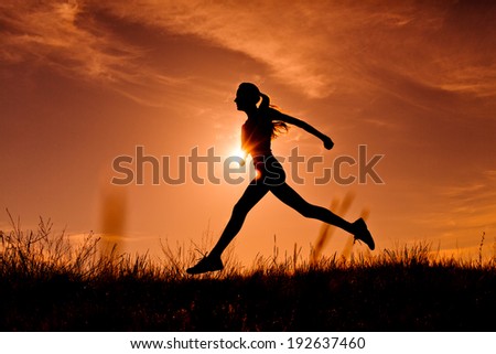 Running woman. Healthy running runner woman early morning sunrise workout jog on dramatic sky. copy space
