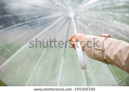 Woman holding umbrella. focus on hand