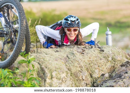 Sport funny bike woman on a mountain with a beautiful landscape