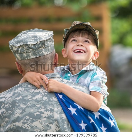 Beautiful modern american family. Father wearing military uniform hugs his son