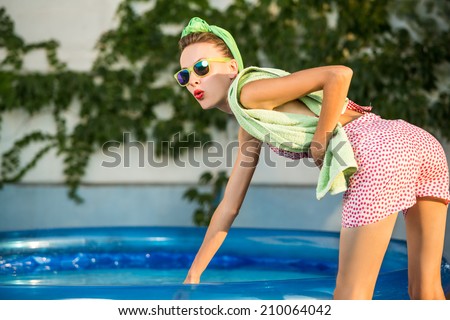 Sexy pinup girl in swimming pool