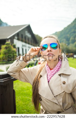 Young beautiful woman in small mountain town enjoy the freshness of the new day