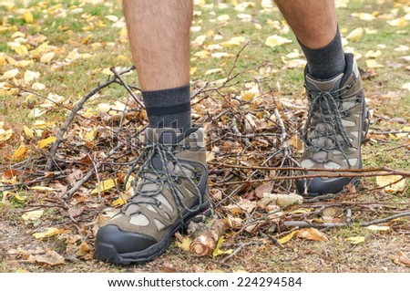 Hiking boots in autumn scenery