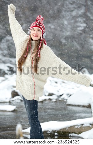 Free happy woman enjoying nature and listen music. Freedom concept