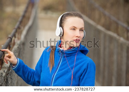 Music running woman looking relaxing looking to the side. copy space