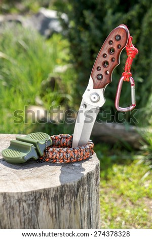 Survival kit - paracord bracelet and knife. focus on knife