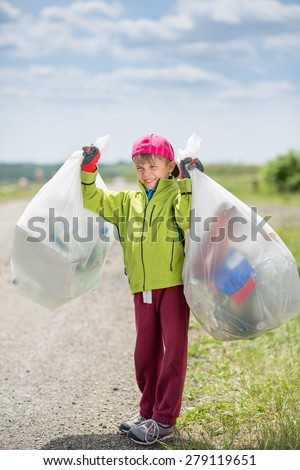 Boy picking up trash