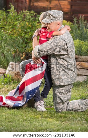 Military man father hugs son. Portrait of happy american family