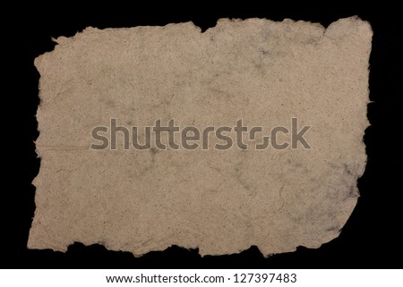 Hand made paper from hemp fibers. Coarse, rough-edged and fibrous. Isolated on black background.