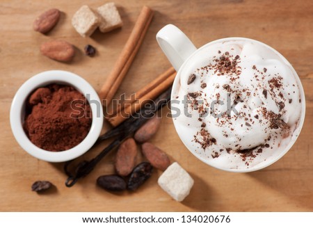 Cocoa drink ingredients. Cocoa beans and powder, Cinnamon, vanilla pod, sugar Cubes.