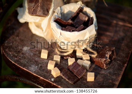 Chocolate  pieces and lumps of sugar