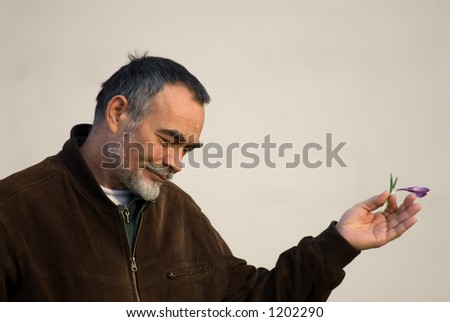 elderly man in brown jacket