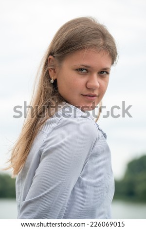 young business woman looking behind her shoulder