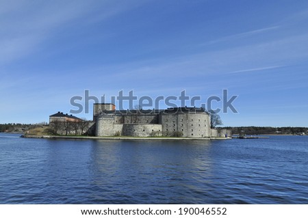 VAXHOLM, SWEDEN - APRIL 16: A view on Vaxholm fortress with sea around in Vaxholm, Sweden on April 16, 2014