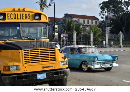 HAVANA, CUBA - DECEMBER, 7: Cuban vintage cars and buses on the main square in Havana, Cuba on December 7, 2013
